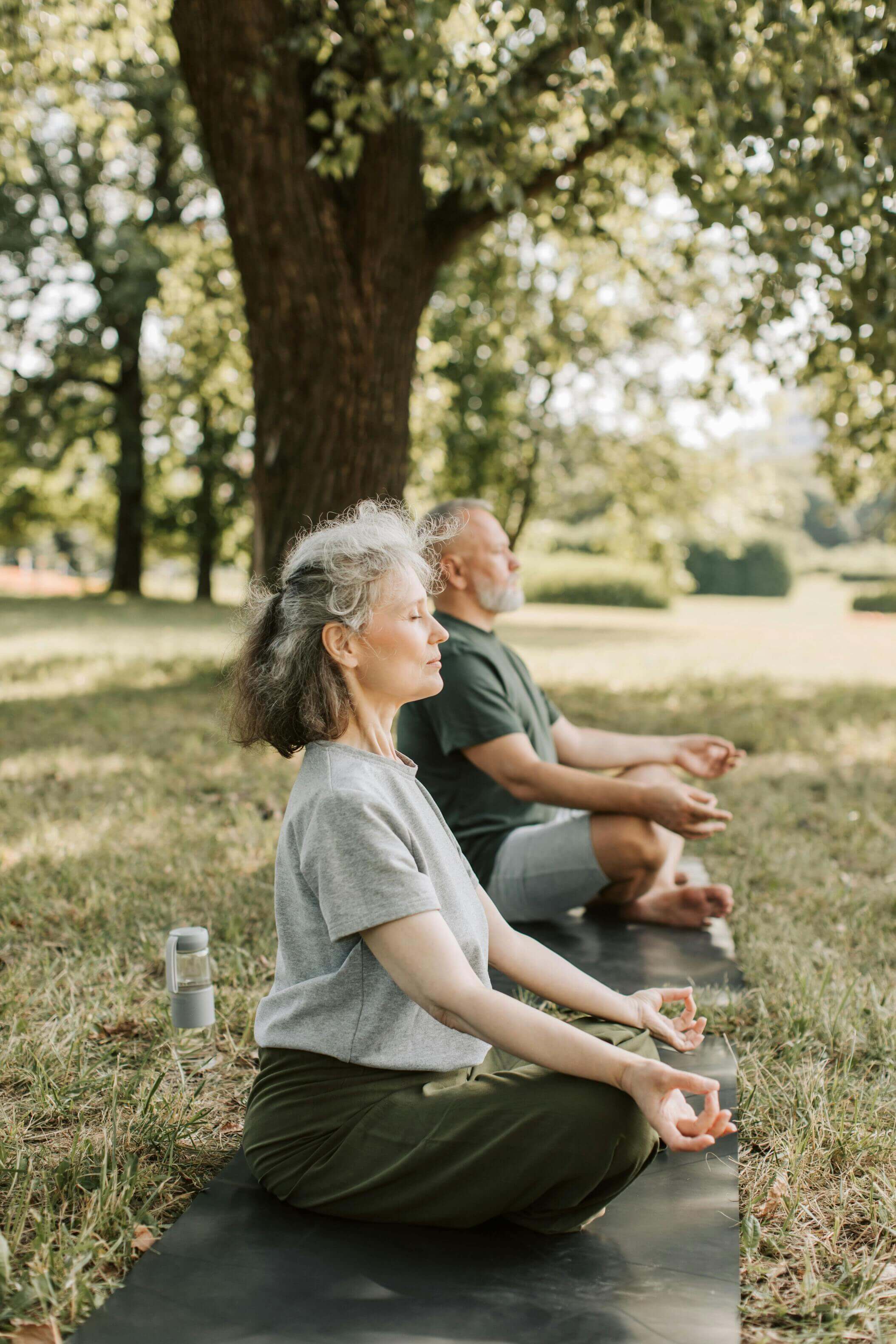 couple meditating in nature